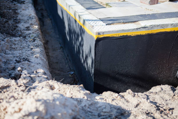 Professional Basement Waterproofing technician working in Reynolds, IN